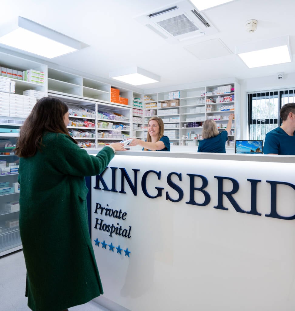 patient at desk in Kingsbridge hospital